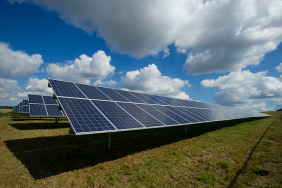 Solar panel farm from aerial view showing drone thermal inspection for hotspot detection